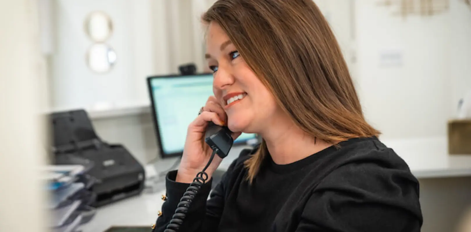 our front desk talking to a patient about veneers
